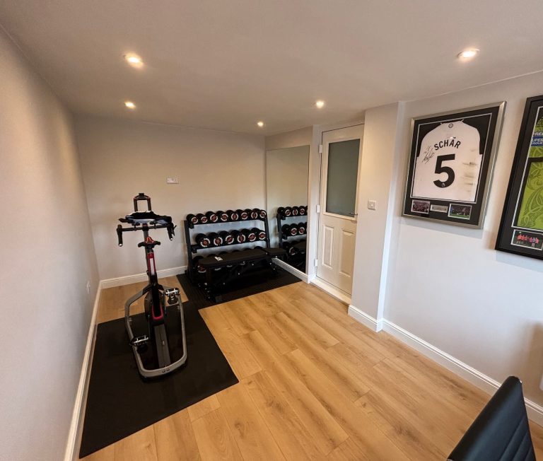 garage conversion Leeds home gym finished with gym equipment and LVT flooring
